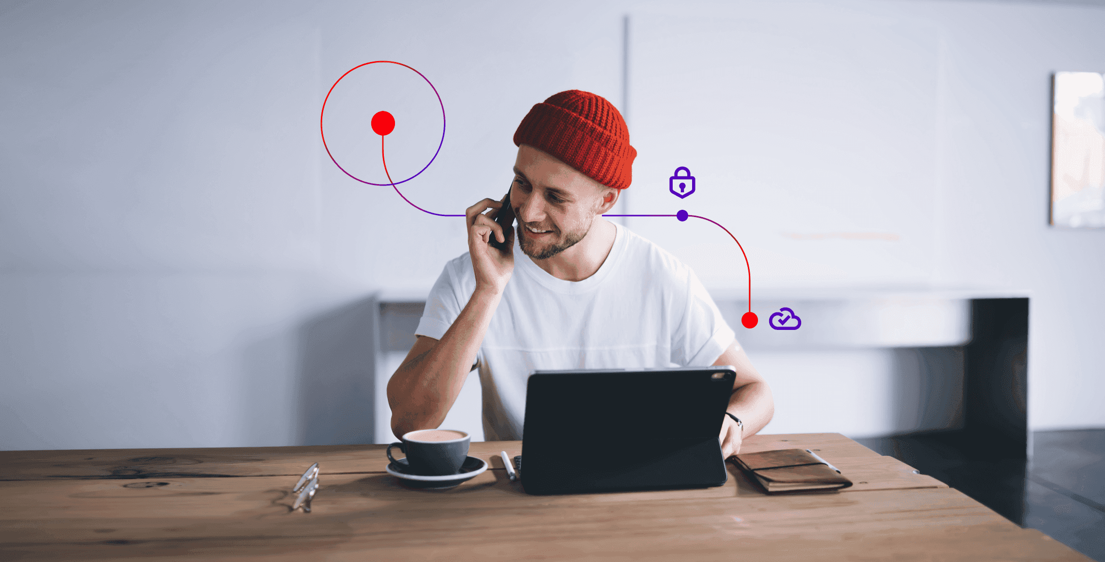 A man, talking on the phone and using a computer to migrate his retail contact center to the cloud.